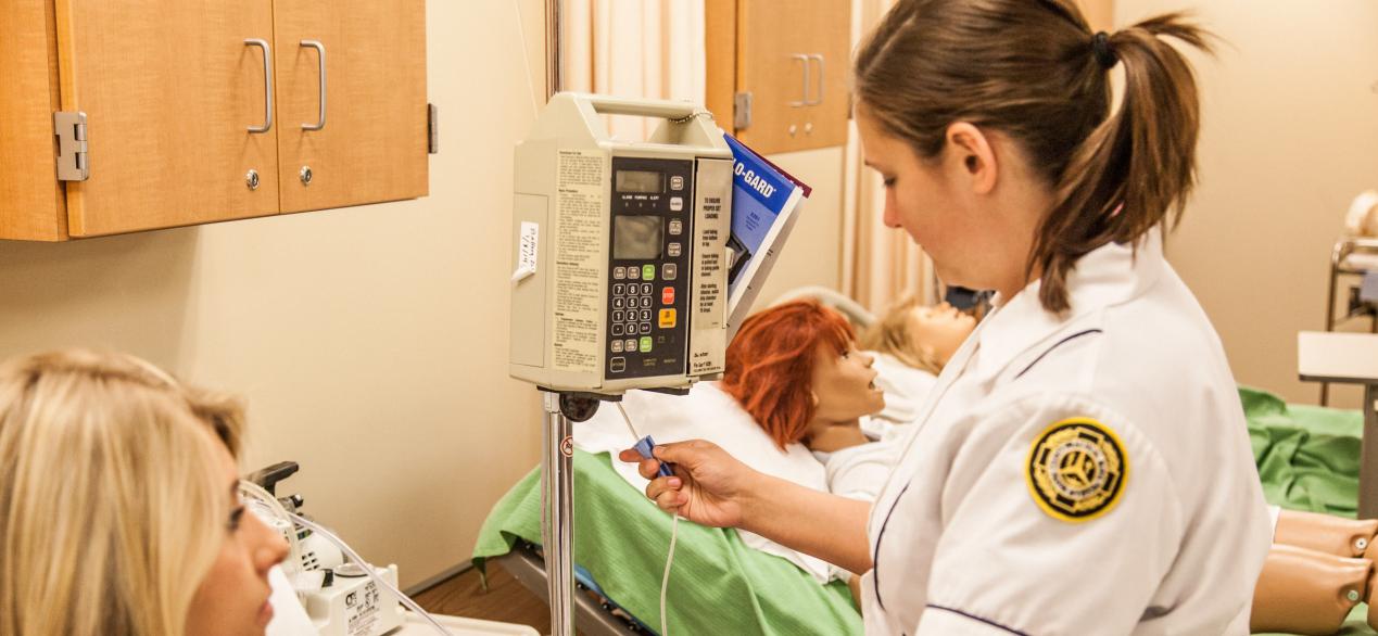 Image of female student taking vital signs