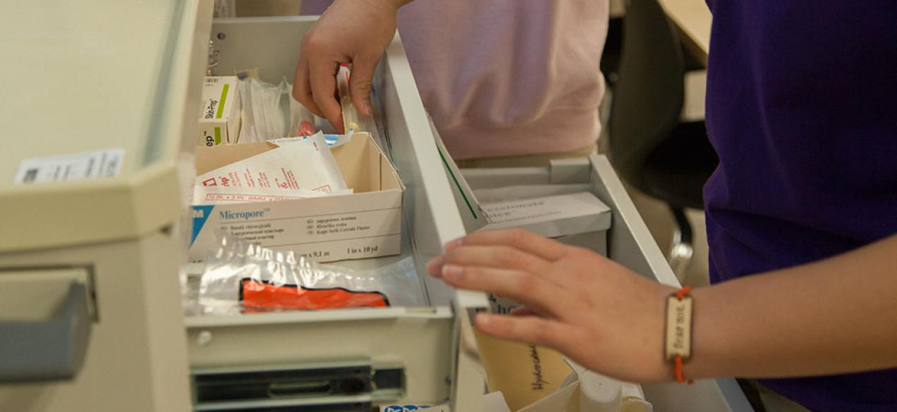 Image of student working on a medicine cart