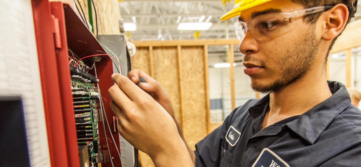 Image of student working on wiring project