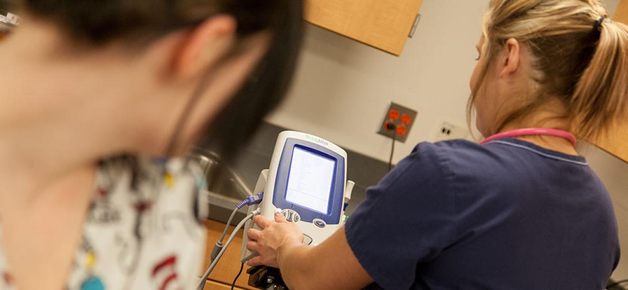 Girl performing EKG